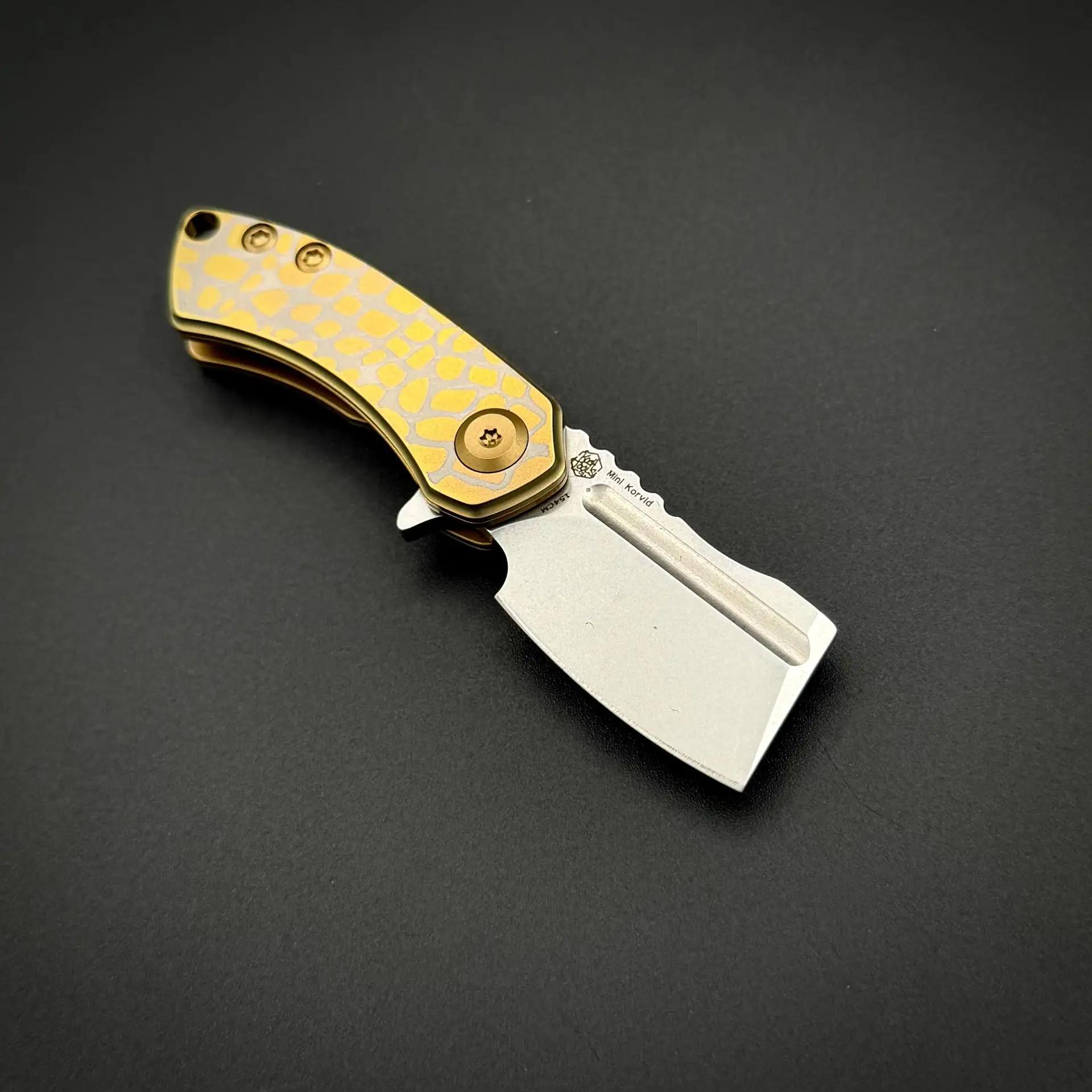 Складной нож Mini Korvid 154CM Golden Anodized Titanium with Laser-Etched Cracked Eggshell Pattern